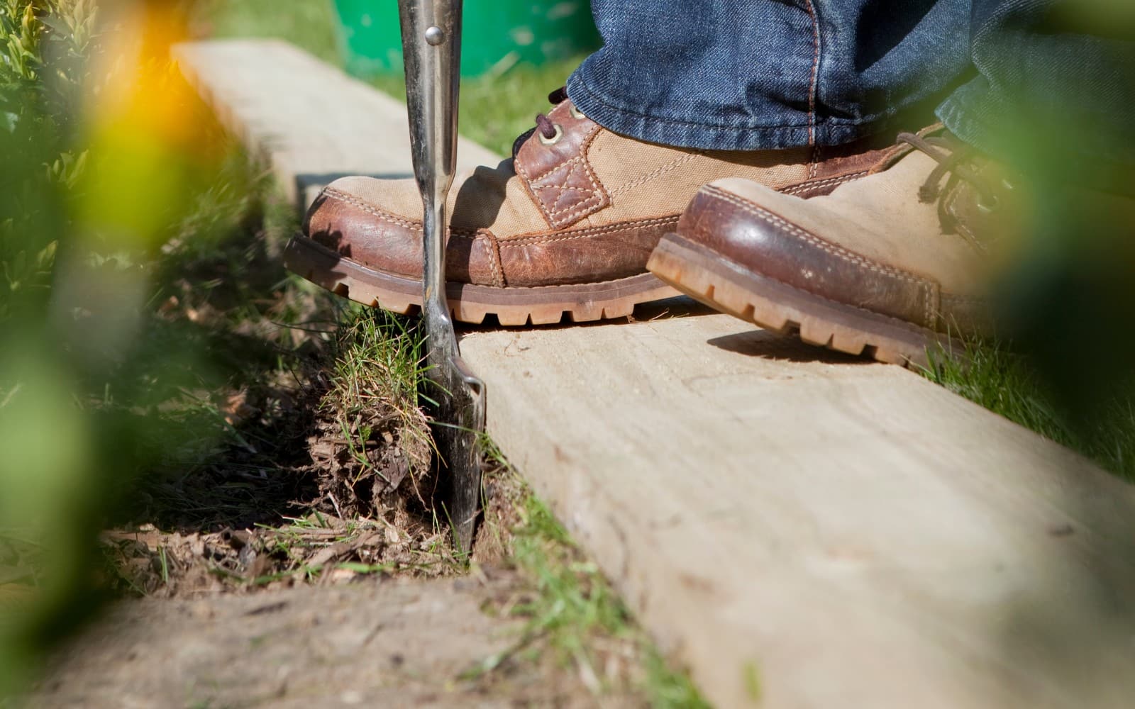 Man Trimming a Lawn Edge